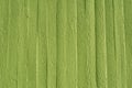 Green concrete wall with wooden structure