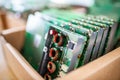 Green control chips of TFT monitors in cardboard box in shop Royalty Free Stock Photo