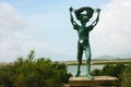 Green copper statue of the old salt worker in the salt flats in ibiza