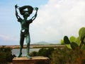 Green copper statue of the old salt worker in the salt flats in ibiza