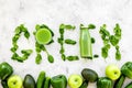 Green copy for greeny smoothy composition with vegetables on stone background top view mockup
