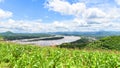 Green corn field in plantation agriculture Asian with river and blue sky background - nature of beautiful morning corn field on Royalty Free Stock Photo