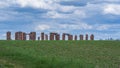 green cornfields, blue skies, ruins of red bricks and rubble Royalty Free Stock Photo
