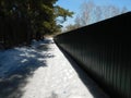 Green corrugated fence in perspective