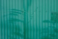 Green corrugated metal fence. Part of the fence Royalty Free Stock Photo