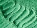 Green cosmetic clay powder facial mask, face cream, body wrap texture close up, selective focus. Abstract background Royalty Free Stock Photo