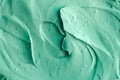 Green cosmetic clay texture close up, selective focus. Abstract background. Royalty Free Stock Photo
