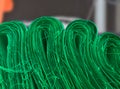 green cotton cloth rolls in industrial room