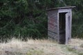 Wooden Cabin - Toilet in the woods in nature Royalty Free Stock Photo