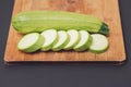 Green courgette or zucchini fresh and raw whole and sliced