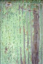 Green cracked old paint on weathered wooden plank texture background Royalty Free Stock Photo