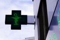 Green cross Pharmacy sign in street Royalty Free Stock Photo