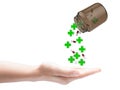 Green cross and pills falling Royalty Free Stock Photo