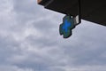 green cross-shaped pharmacy sign with sky in the background Royalty Free Stock Photo