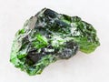 green crystal of Chrome Diopside gemstone on white