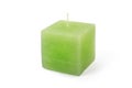 Green cube-shape candle on white background