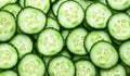 Green cucumber rounds arranged in perfect symmetry. Royalty Free Stock Photo