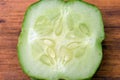 Green cucumber in the slit close-up photo.