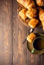 Green cup of tea with mini chocolate bun Royalty Free Stock Photo