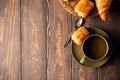 Green cup of tea with mini chocolate bun Royalty Free Stock Photo