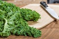 Green curly kale and knife Royalty Free Stock Photo
