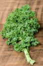 Green curly kale leaf on table Royalty Free Stock Photo