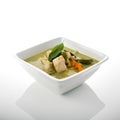 Green curry with chicken in a bowl isolated on a white background. Royalty Free Stock Photo