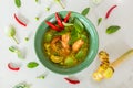 Green curry thai food chilli eggplant basil thyme shrimp Galangal oil  Mon-Khmer hill tribe milk dish cup Royalty Free Stock Photo