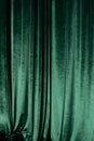 Green curtain of luxurious velvet on the theater stage. Copy space. The concept of music and theatrical art. Royalty Free Stock Photo