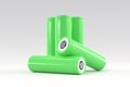 5 green cylindrical batteries on a light gray background. Storage battery or secondary cell. Rechargeable li-ion