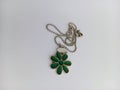 Green Daisy flower necklace on a white background