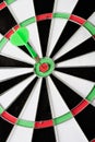 Green dart punctured in the center Royalty Free Stock Photo