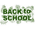 Green decor text back to school with bell, book, pencils and leaves