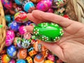 Green decorated Easter egg in hand on traditional Easter market in Krakow Royalty Free Stock Photo