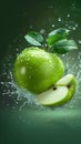 Green delight Water splashing on a fresh apple and sliced piece Royalty Free Stock Photo