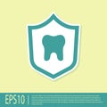 Green Dental protection icon isolated on yellow background. Tooth on shield logo. Vector