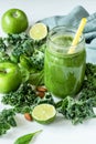 Green detox smoothie or blended juice in glass bottle on white Royalty Free Stock Photo