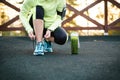 Green detox smoothie cup and woman lacing running shoes before w Royalty Free Stock Photo