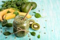 Green detox smoothie in a glass jar with banana, kiwi, spinach Royalty Free Stock Photo