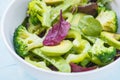 Green dietary vegetable salad with peas, broccoli, avocado and pump Royalty Free Stock Photo