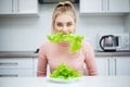 Green diet. Young beautiful woman eating healthy food - salad Royalty Free Stock Photo