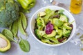 Green dietary vegetable salad with peas, broccoli, avocado and pump Royalty Free Stock Photo