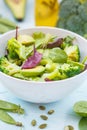 Green dietary vegetable salad with peas, broccoli, avocado and pump Royalty Free Stock Photo