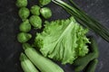 Green different vegetables on a dark background Royalty Free Stock Photo