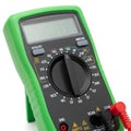 Green digital multimeter with black dial and red probe on white background electrical electronic Royalty Free Stock Photo