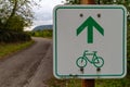 Green directional sign for bikers to ride straight on Royalty Free Stock Photo