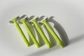 Green disposable shaving razors on white background Royalty Free Stock Photo