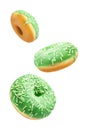 Green donut with white sprinkles on a white isolated background Royalty Free Stock Photo