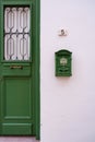 Green door and antique mailbox of a white traditional house in old Nicosia, Cyprus Royalty Free Stock Photo