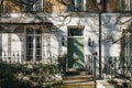 Green door on a facade of traditional English house in Holland Park, London, UK Royalty Free Stock Photo